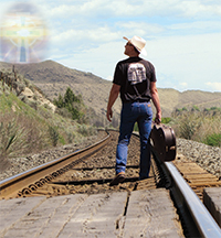 photo of Tom Cole walking on train tracks photo by Margaret Pugh